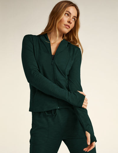 green zip-up hooded jacket. 