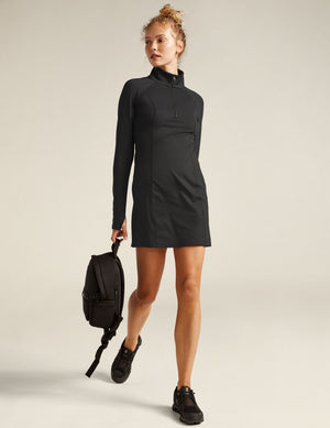 black midi dress with quarter-zup neckline. 