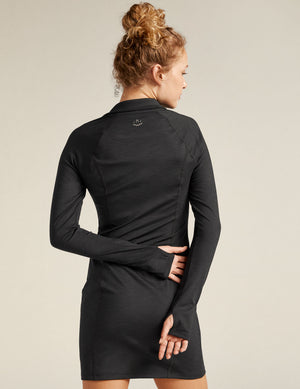 black midi dress with quarter-zup neckline. 