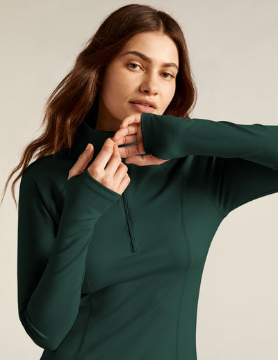green quarter zip long sleeve mini dress.
