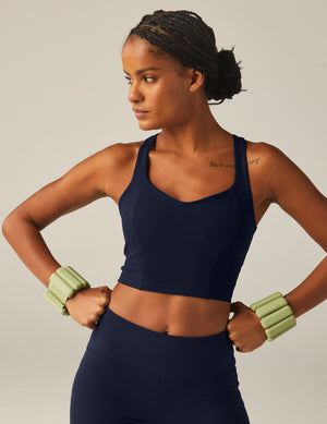 navy blue racerback cropped tank top with a built-in bra and princess seams. 