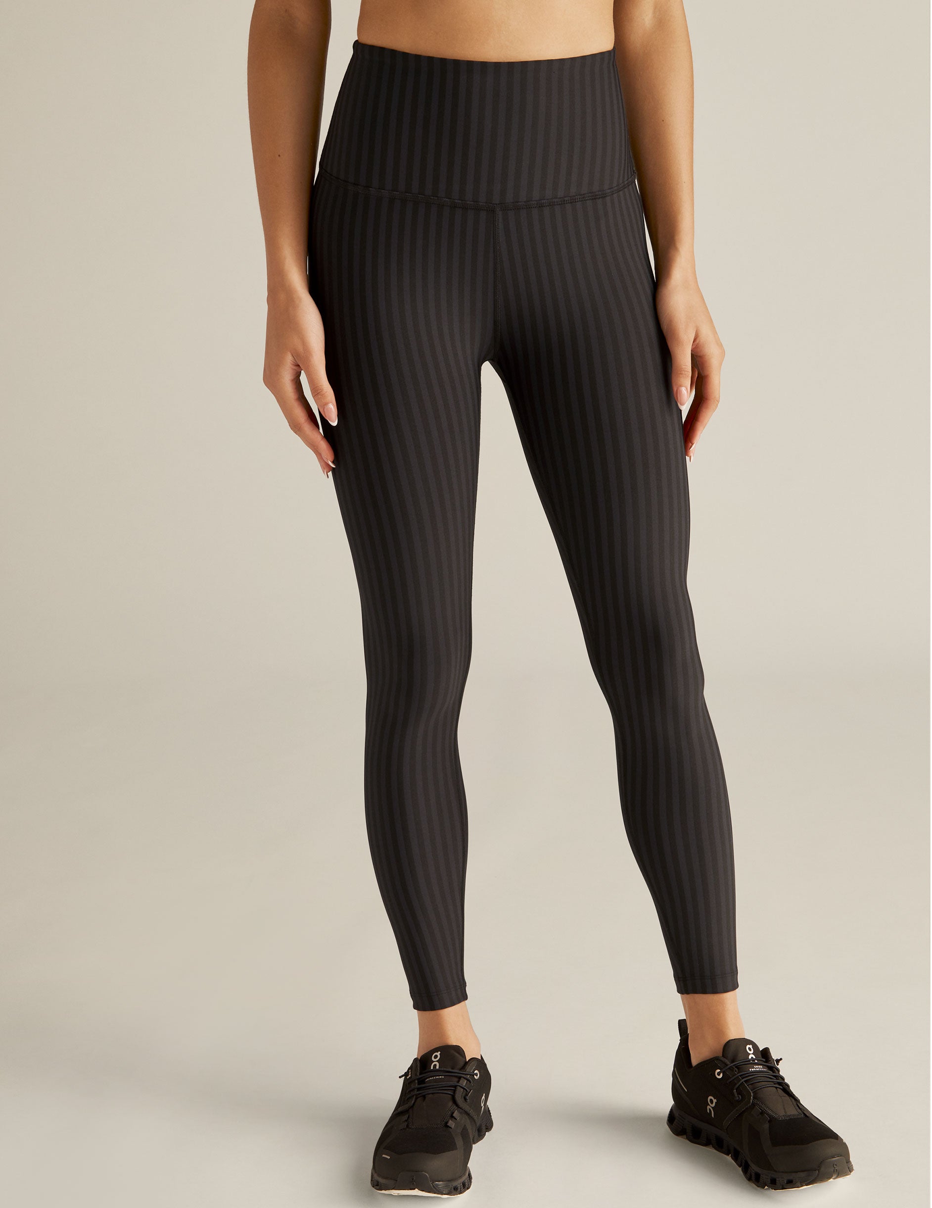 black pin-striped patterned high-waisted midi leggings. 