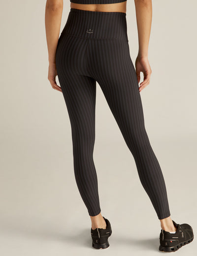 black pin-striped patterned high-waisted midi leggings. 