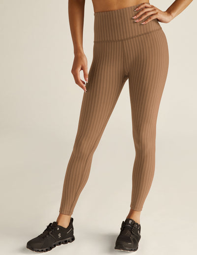 brown pin-striped printed high-waisted midi leggings. 