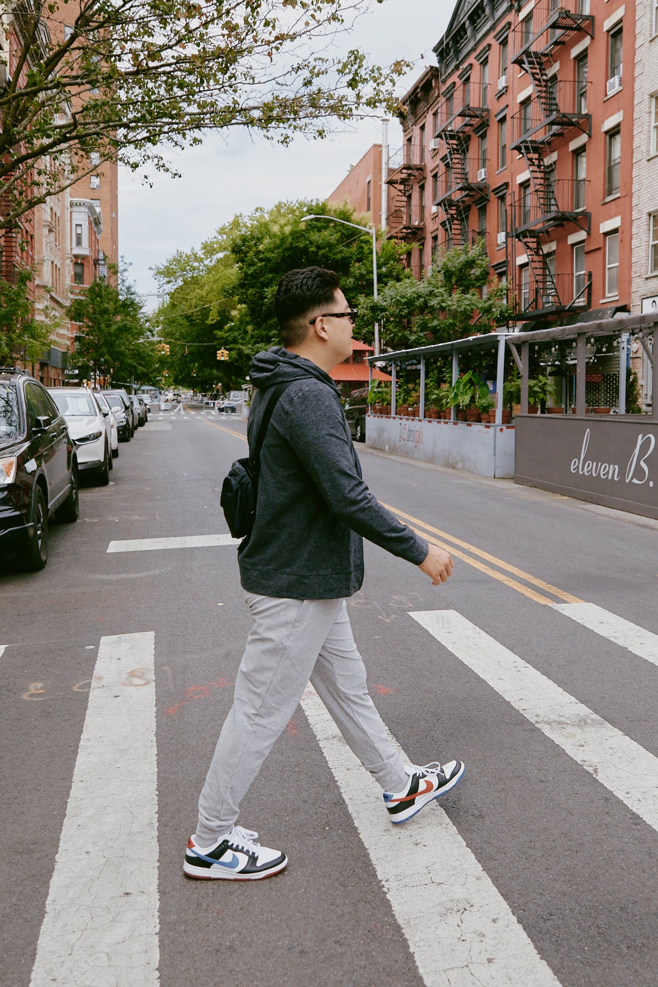 Jae walking down the street in Charcoal and Silver Mist Spacedye