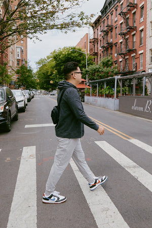 Jae walking down the street in Charcoal and Silver Mist Spacedye