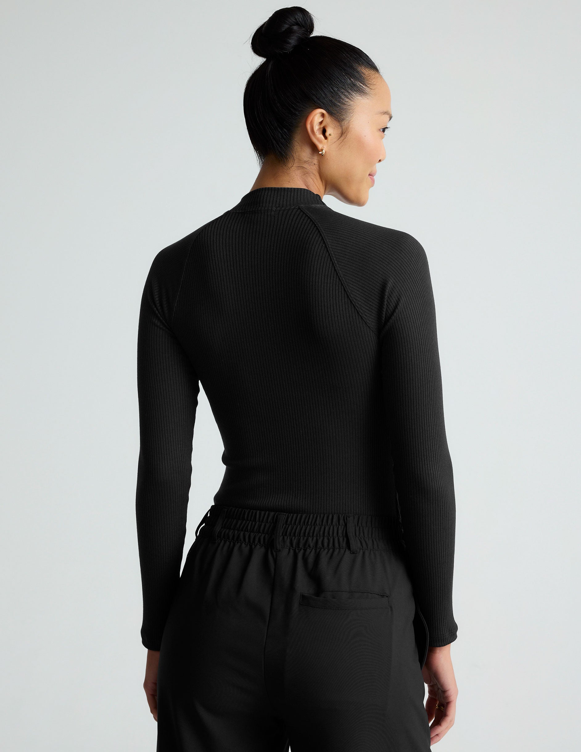 black long sleeve mock neck top.