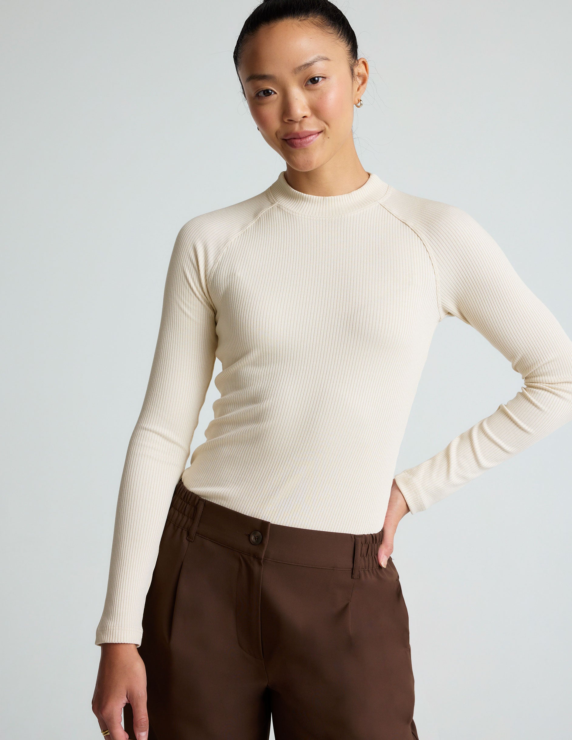 white long sleeve mock neck top.