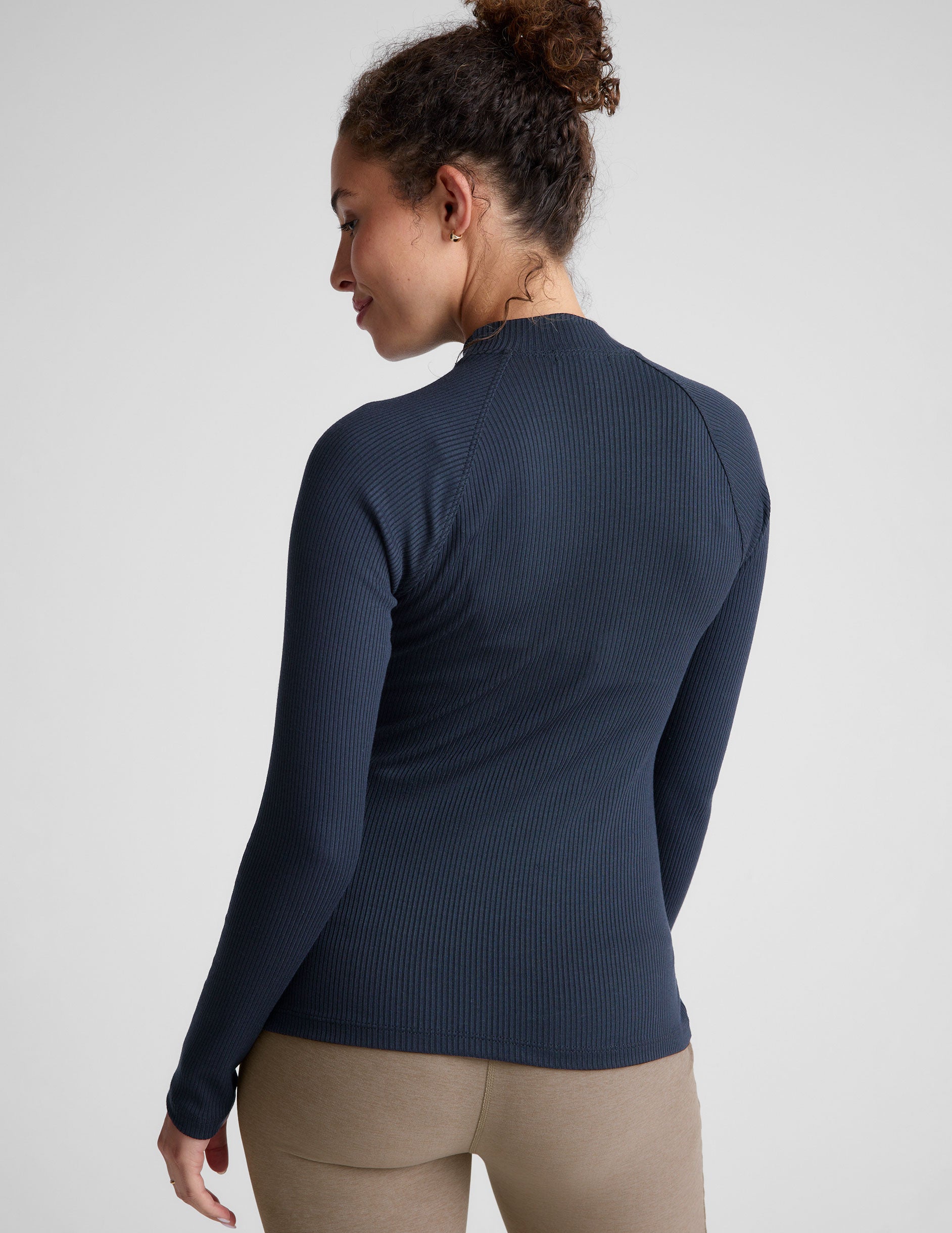 blue mock-neck long length ribbed long sleeve top. 