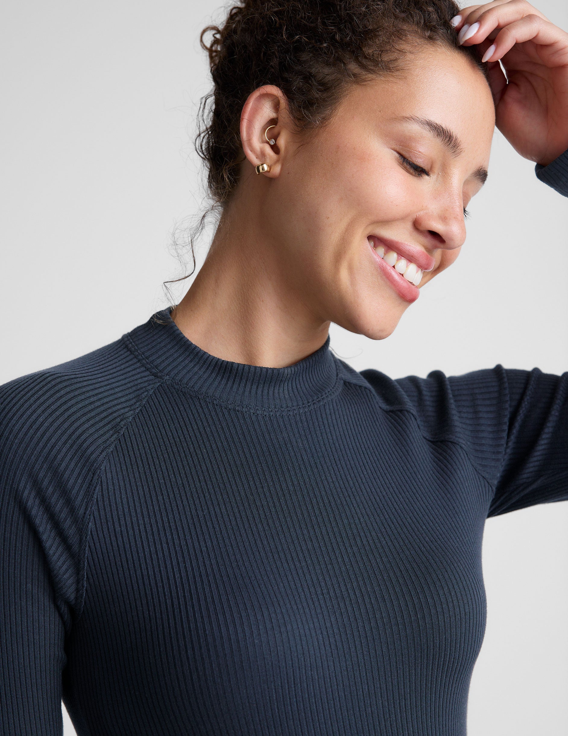 blue mock-neck long length ribbed long sleeve top. 