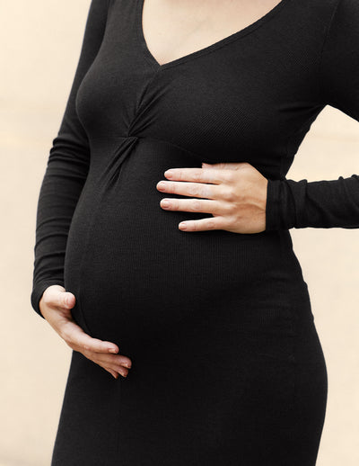 black maternity midi dress with a twist design and front side slit.