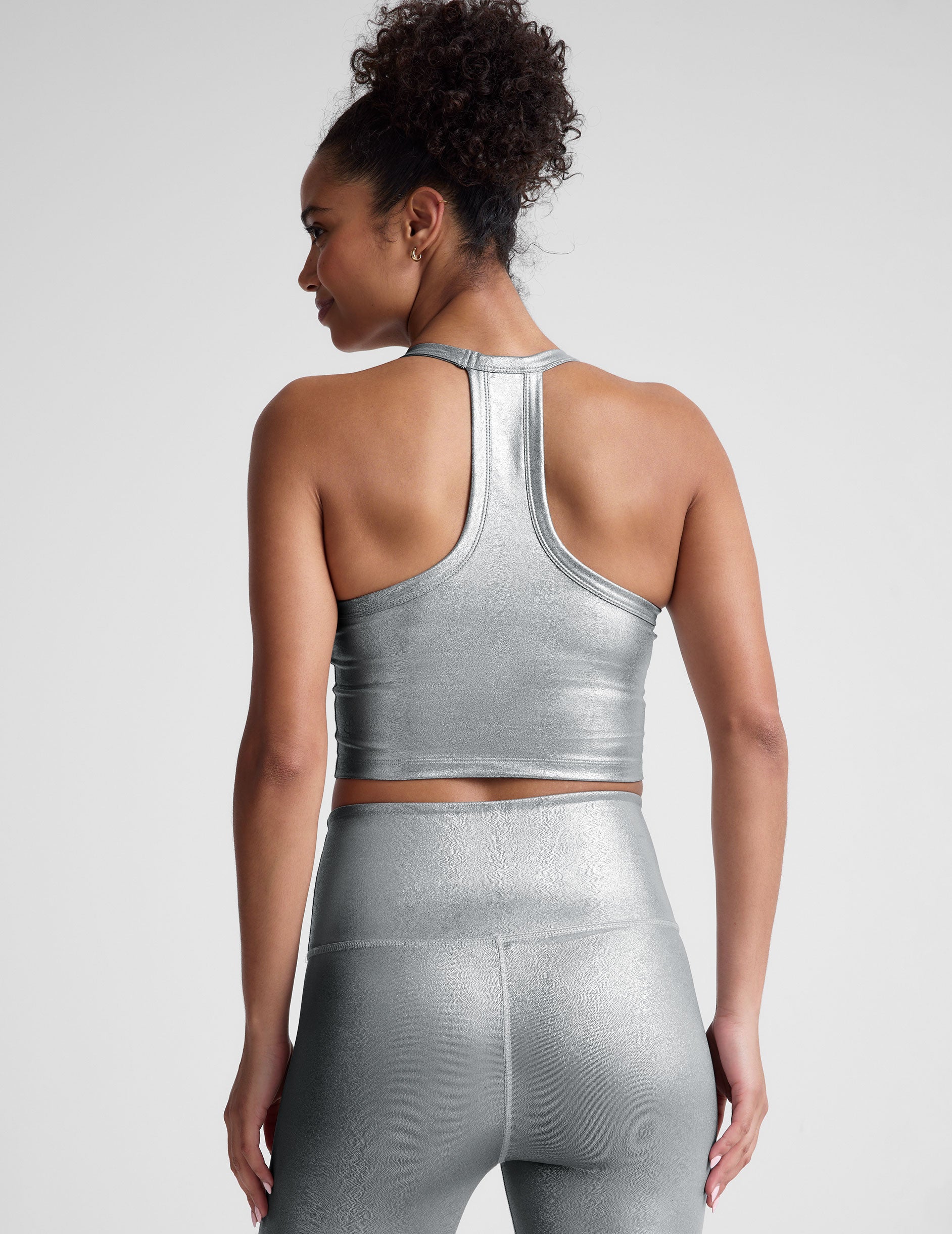 silver crop top.