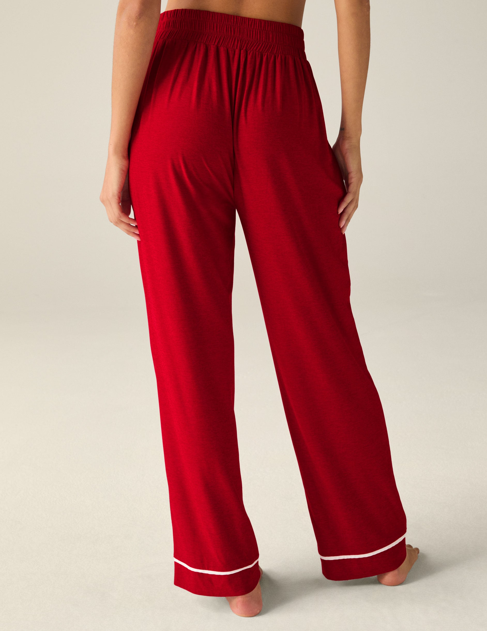 red sleep pants with white piping. 