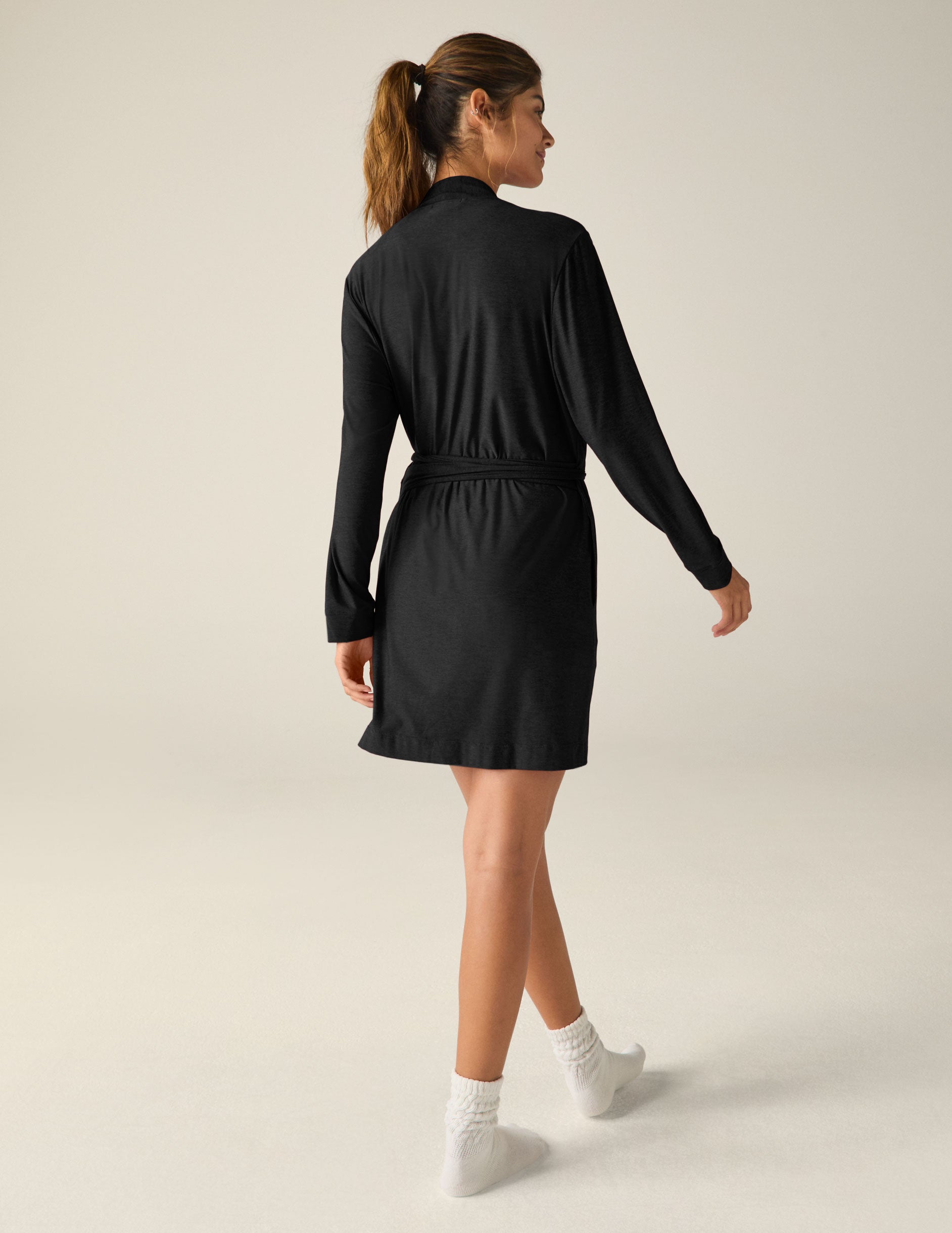 black sleep robe with a tie at the waist and side pockets. 