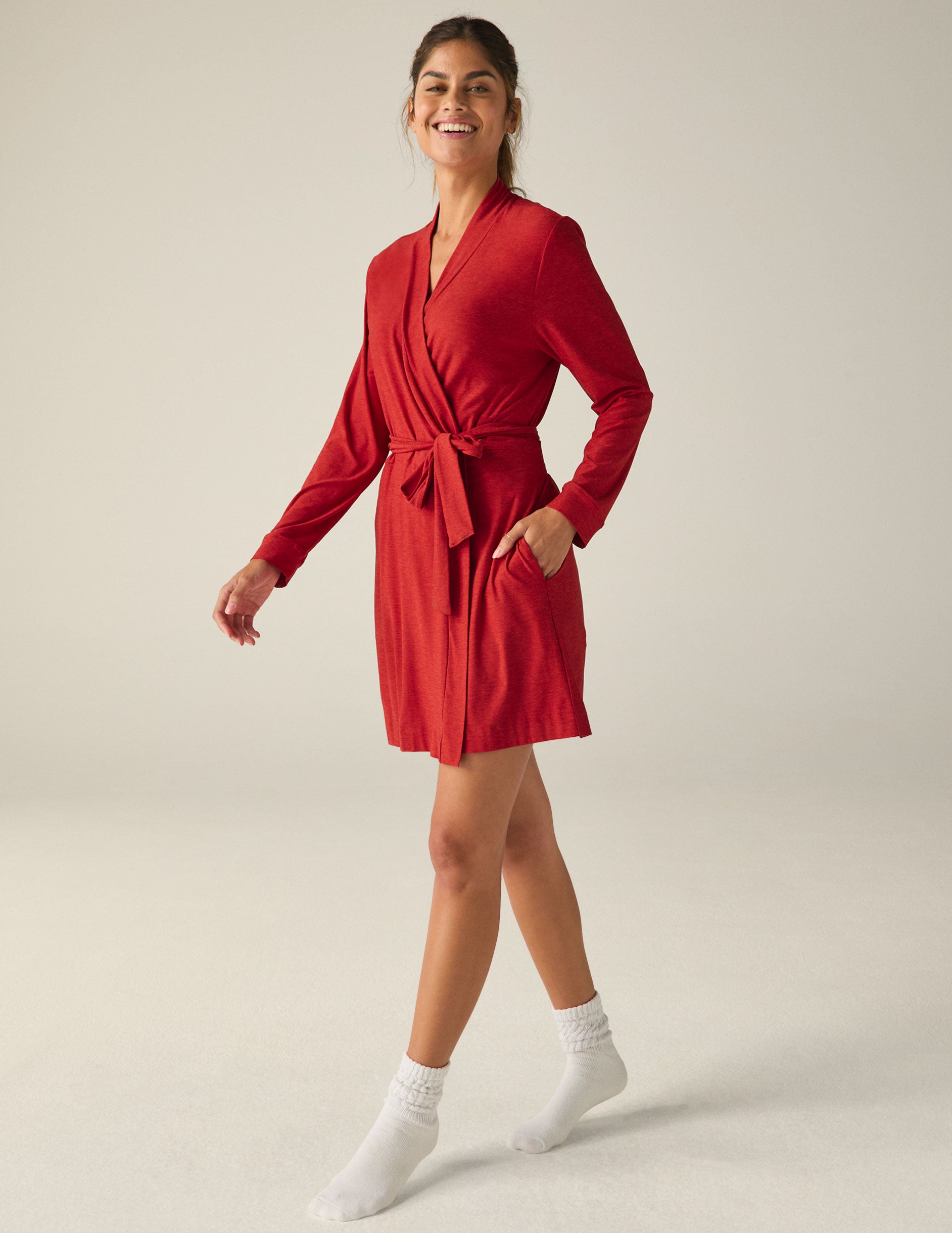 red sleep robe with a tie at the waist and side pockets. 