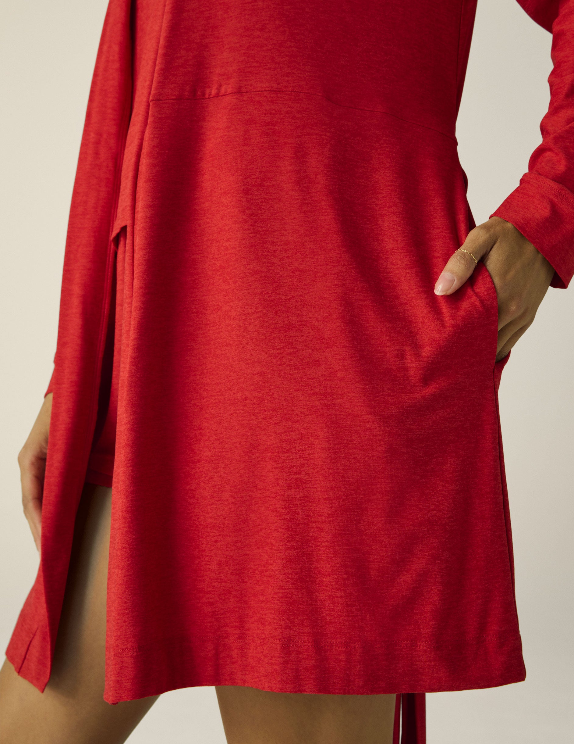 red sleep robe with a tie at the waist and side pockets. 