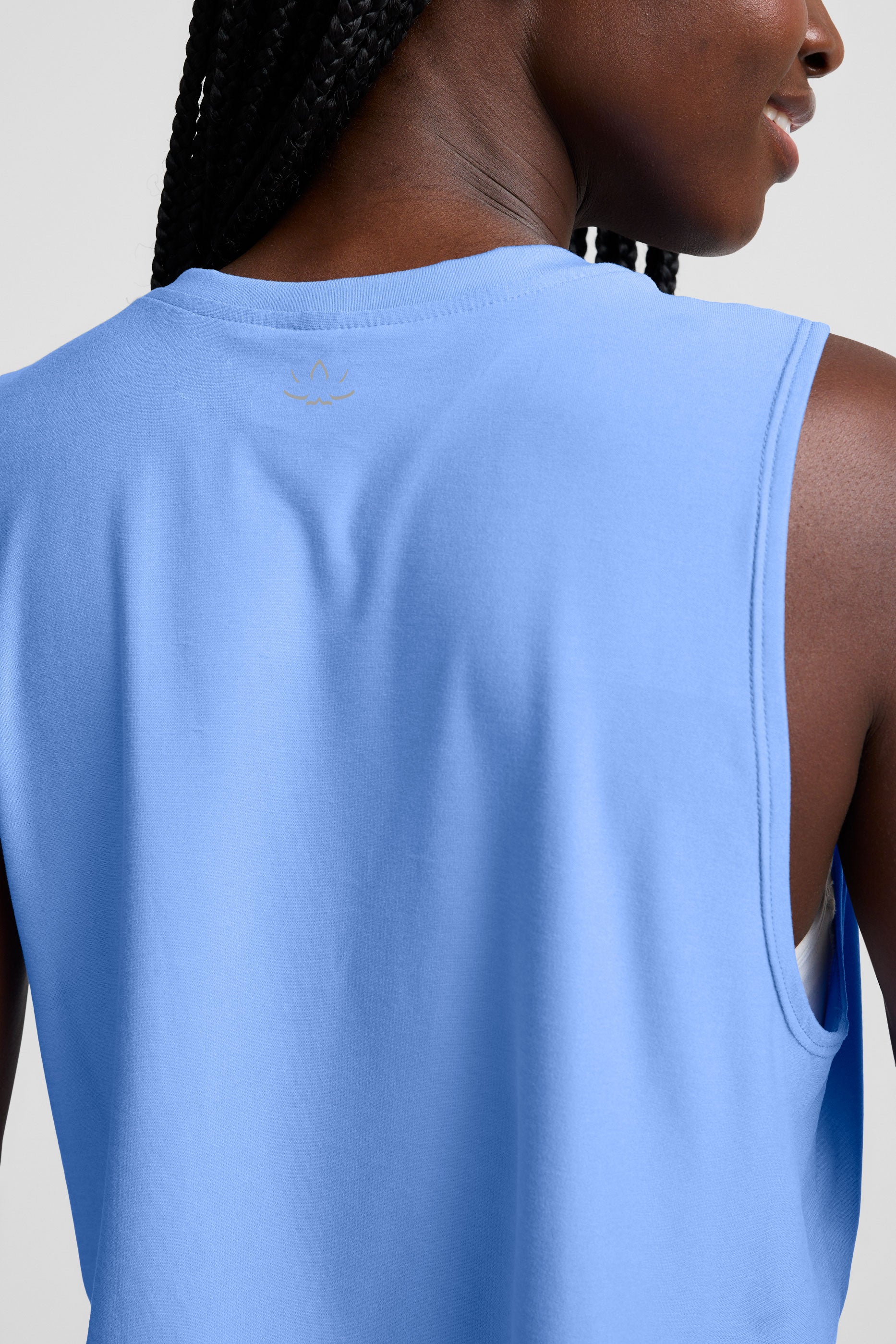 blue lightweight relaxed fit cropped tank top. 