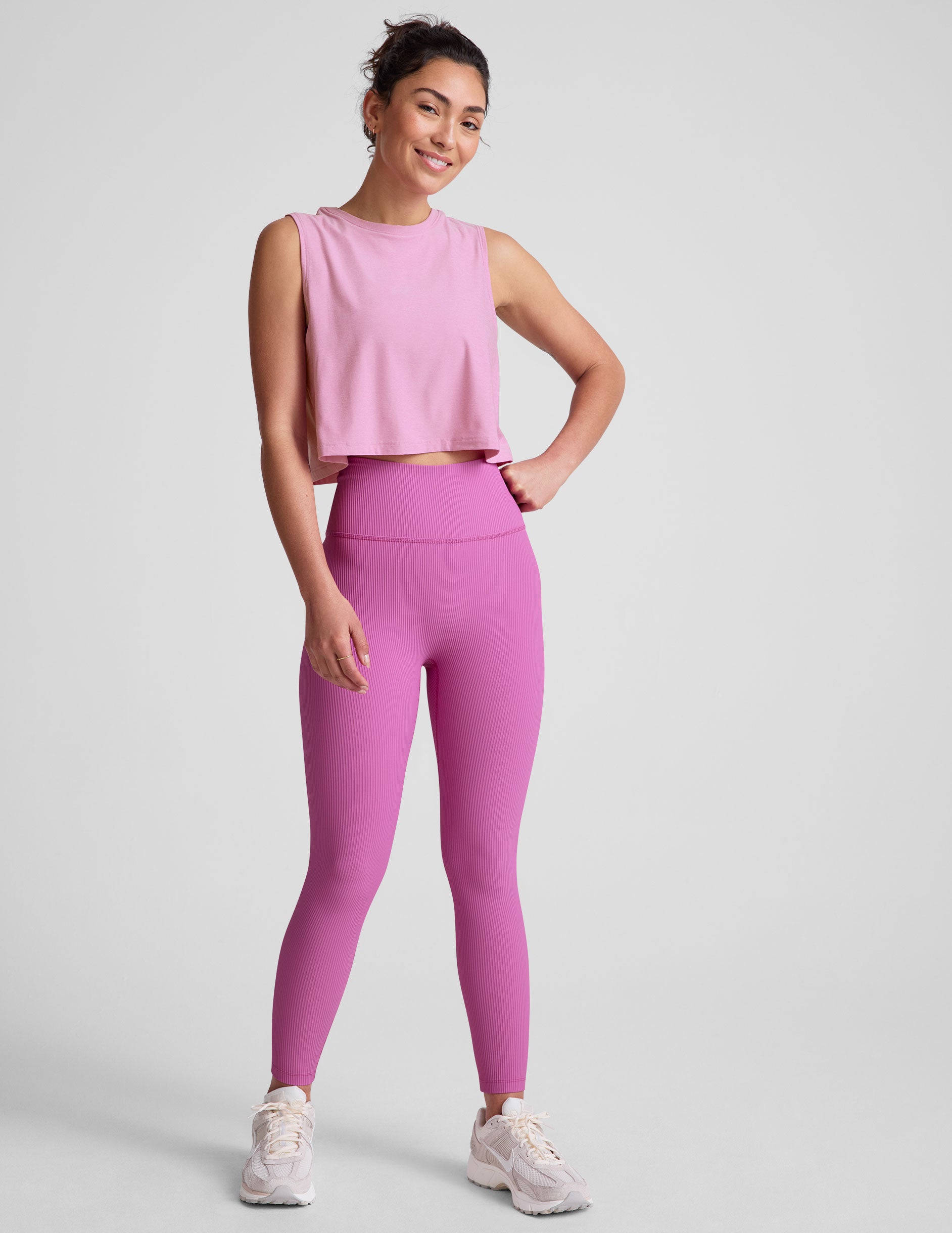 pink relaxed fit cropped tank with a scooped, ribbed neckline, and ribbed arm holes. 