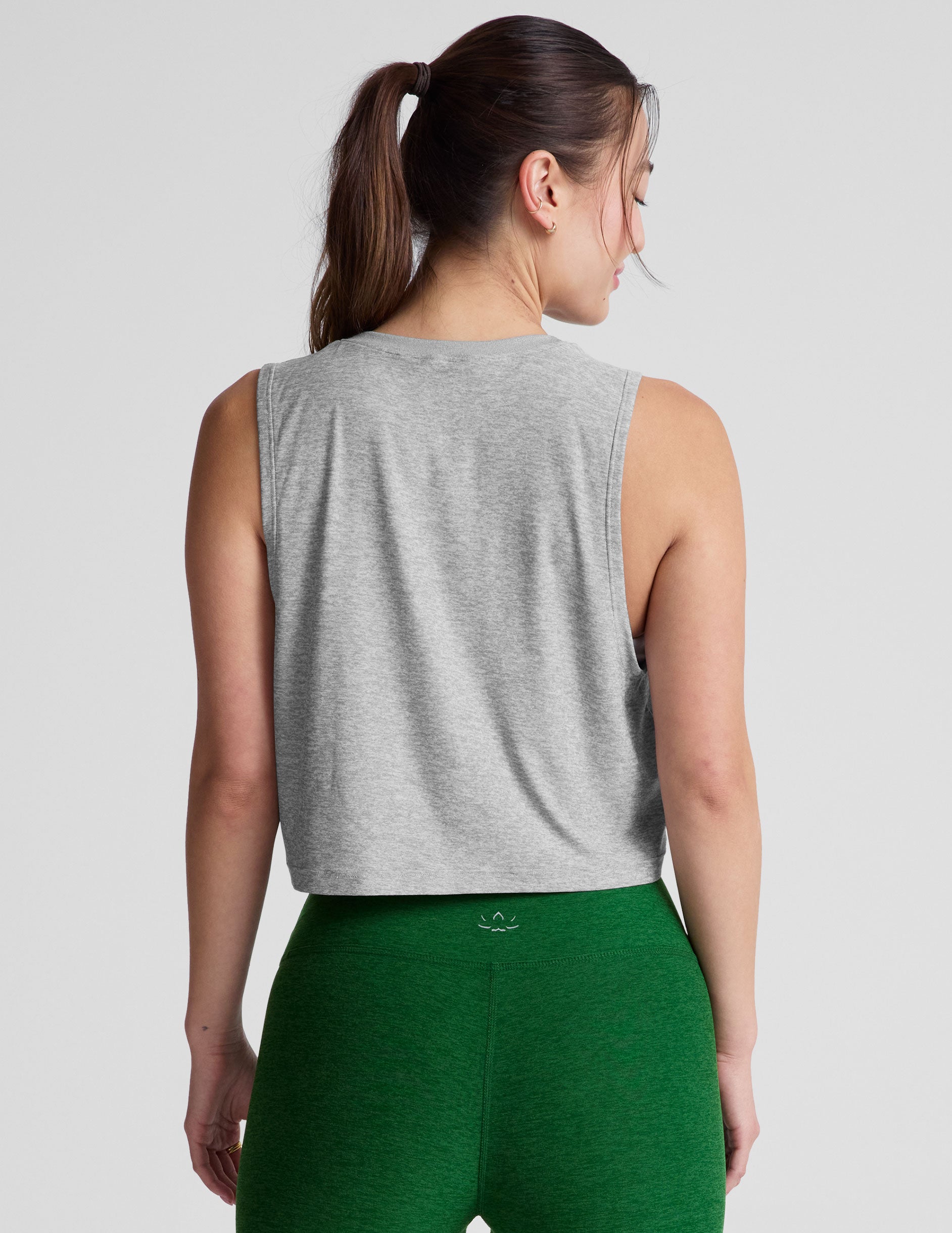 gray relaxed fit cropped tank with a scooped, ribbed neckline and ribbed arm holes. 