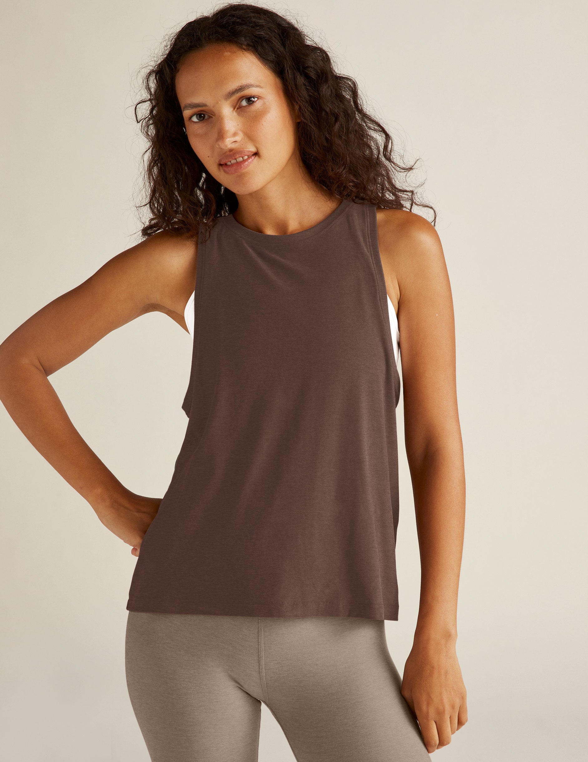 brown loose-fitting high, scooped-neck tank top. 
