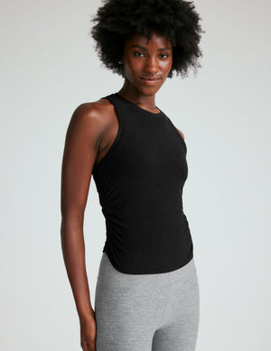 black scoop neck tank top with shirring details down the sides. 