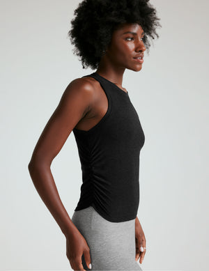 black scoop neck tank top with shirring details down the sides. 
