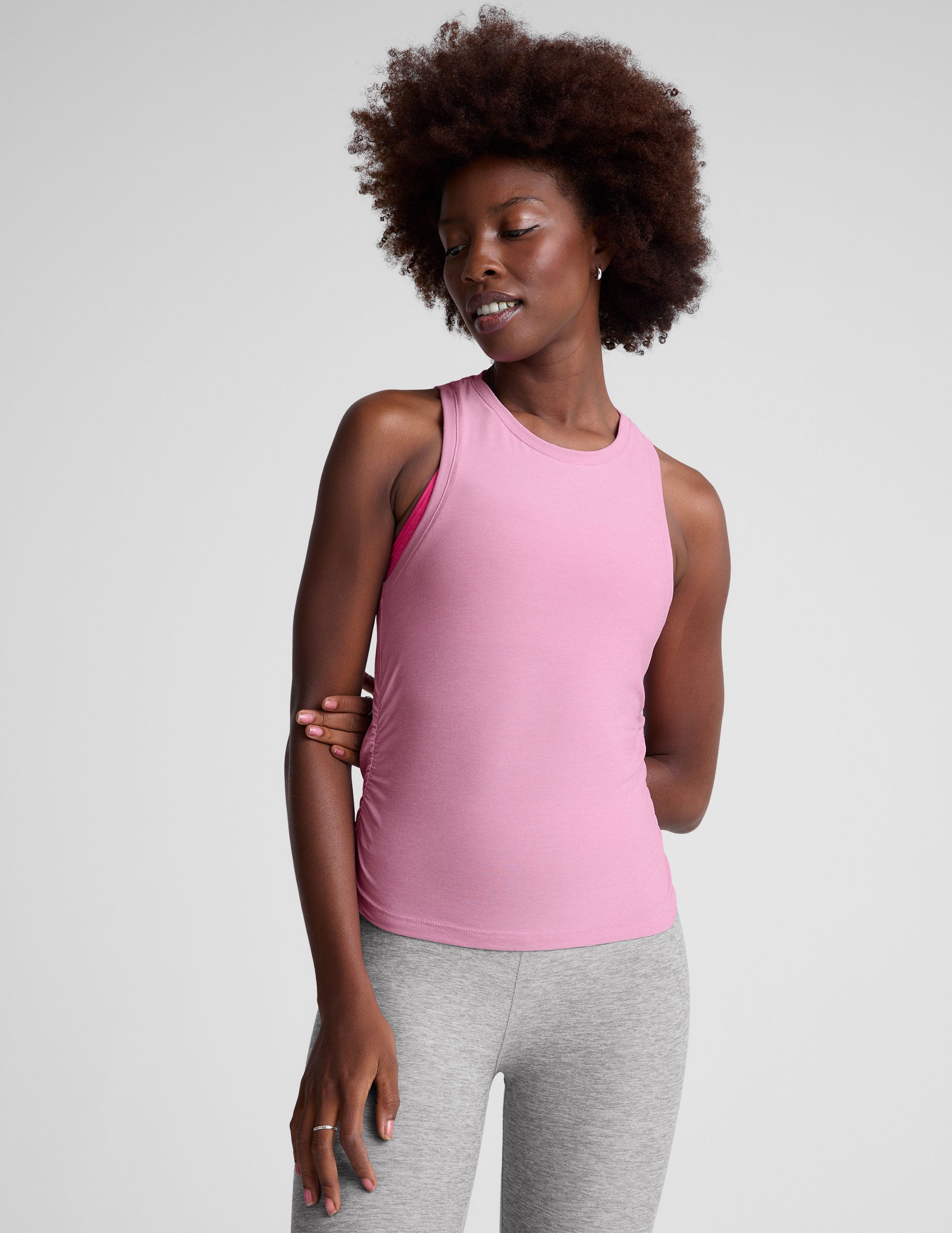 pink scoop neck tank top with shirred detailing on the sides. 