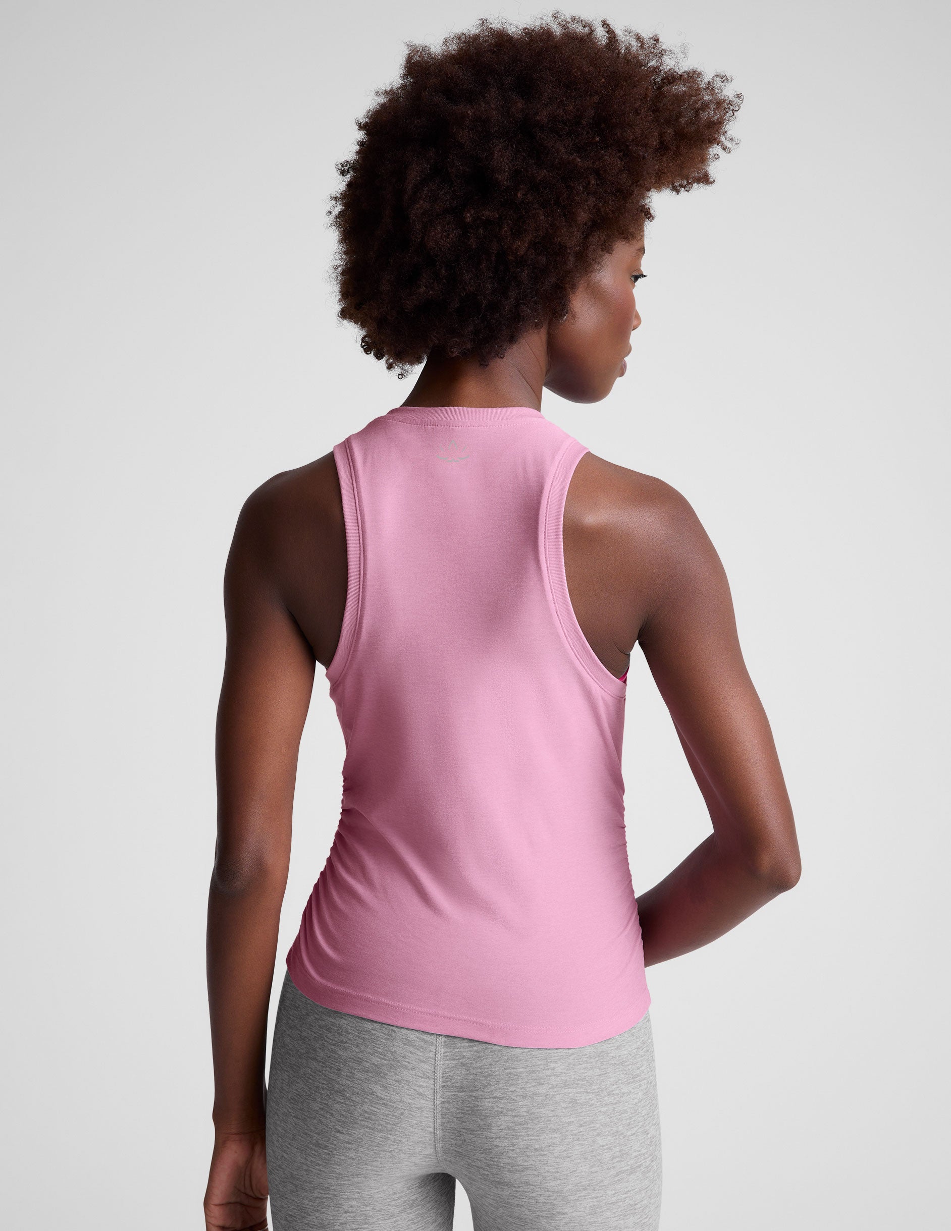 pink scoop neck tank top with shirred detailing on the sides. 