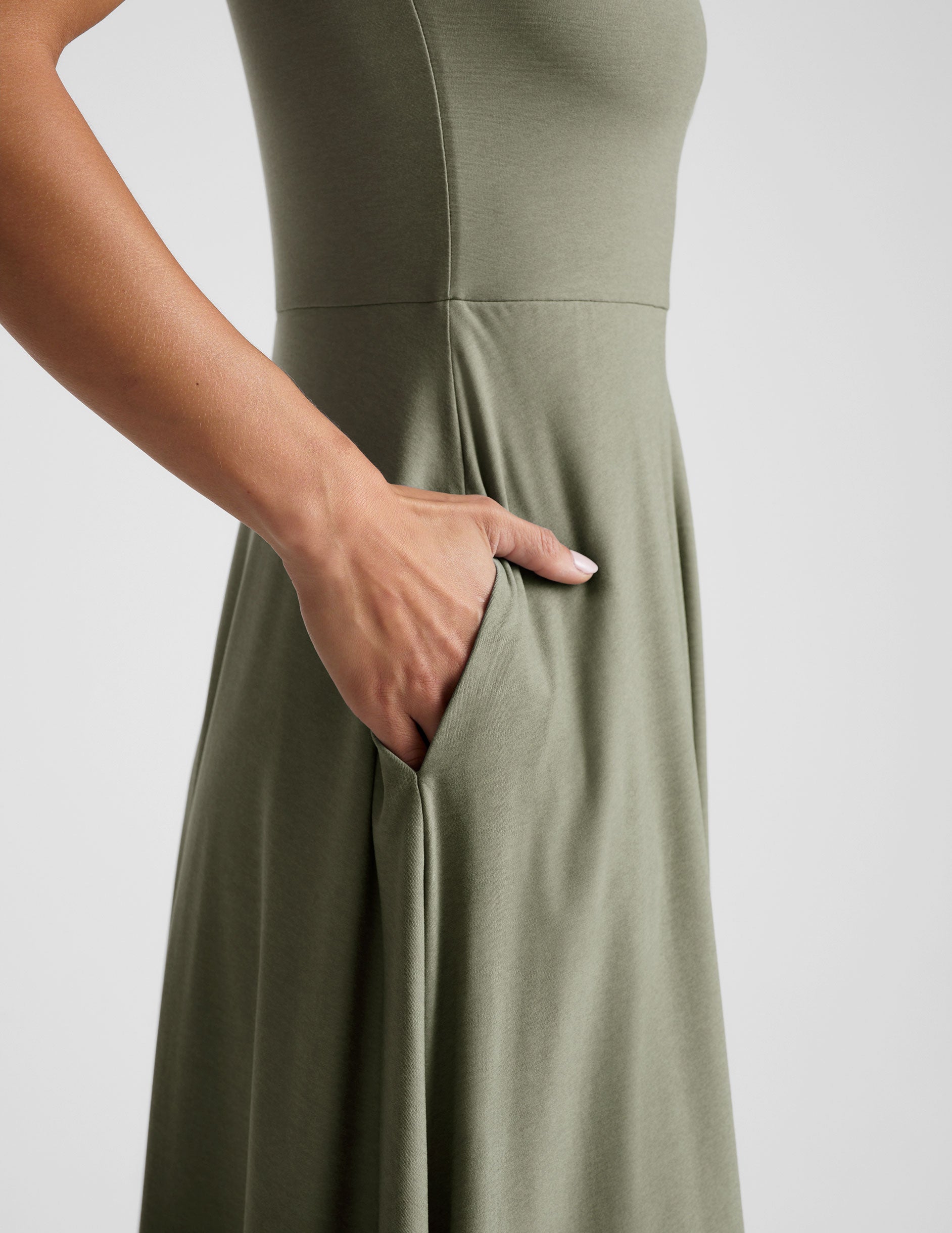 green midi length square neck dress with pockets. 