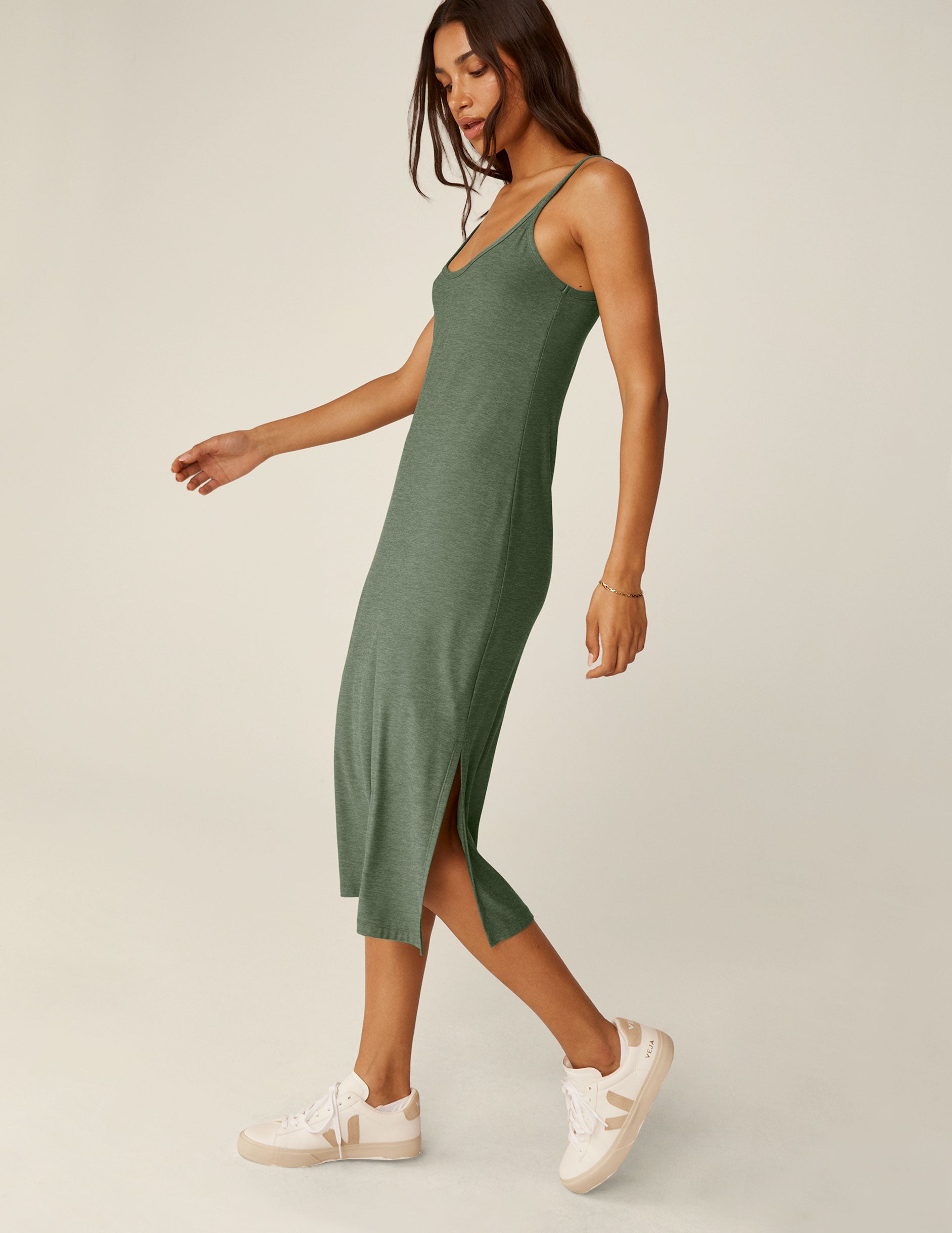 green scoop neck midi dress with slits on each side.