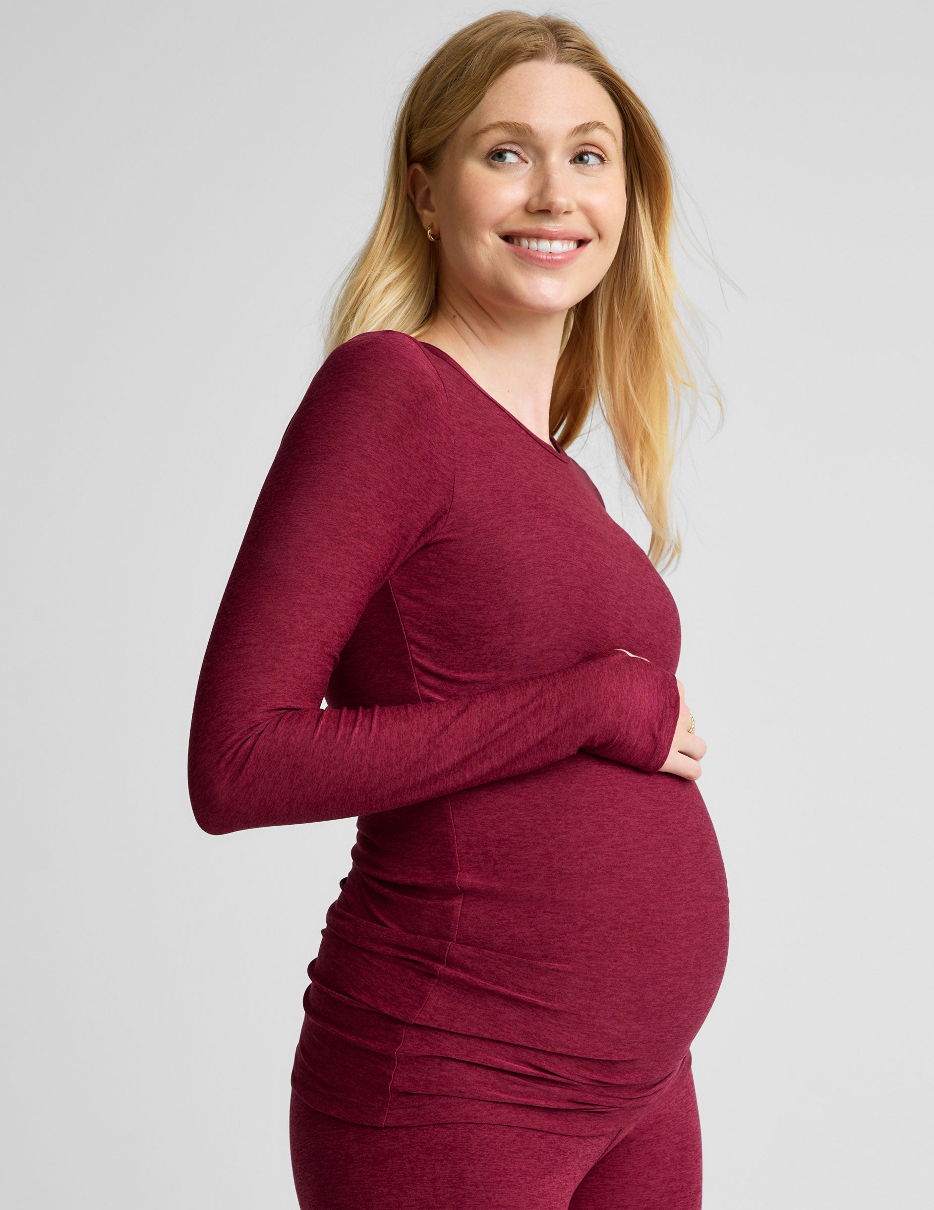 red scoop neck long sleeve maternity top with thumb holes. 