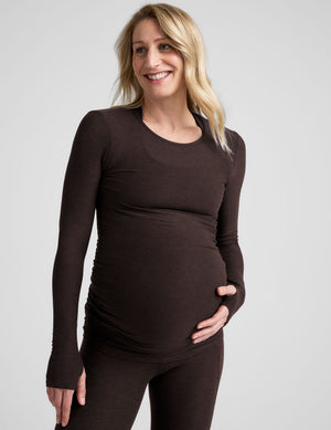 brown long sleeve crew neckline maternity top with thumb holes. 