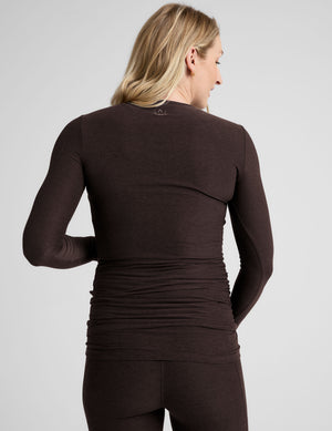 brown long sleeve crew neckline maternity top with thumb holes. 