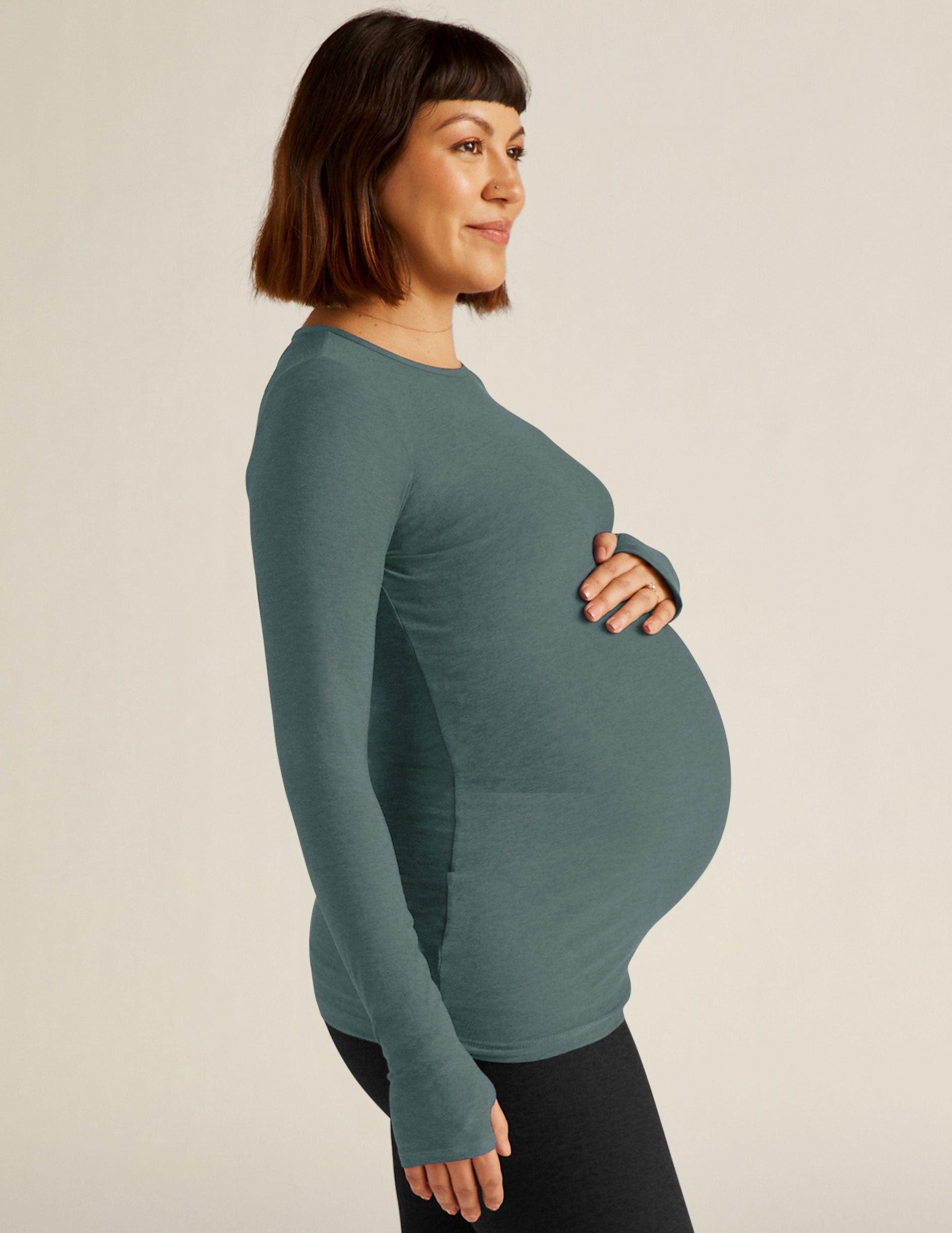 blue long sleeve crew neck maternity top with thumb holes. 