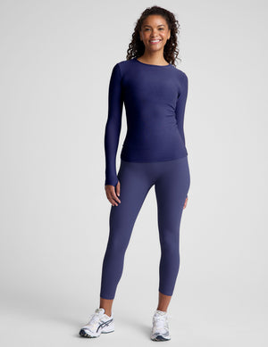 blue long sleeve top with a crew neckline. 