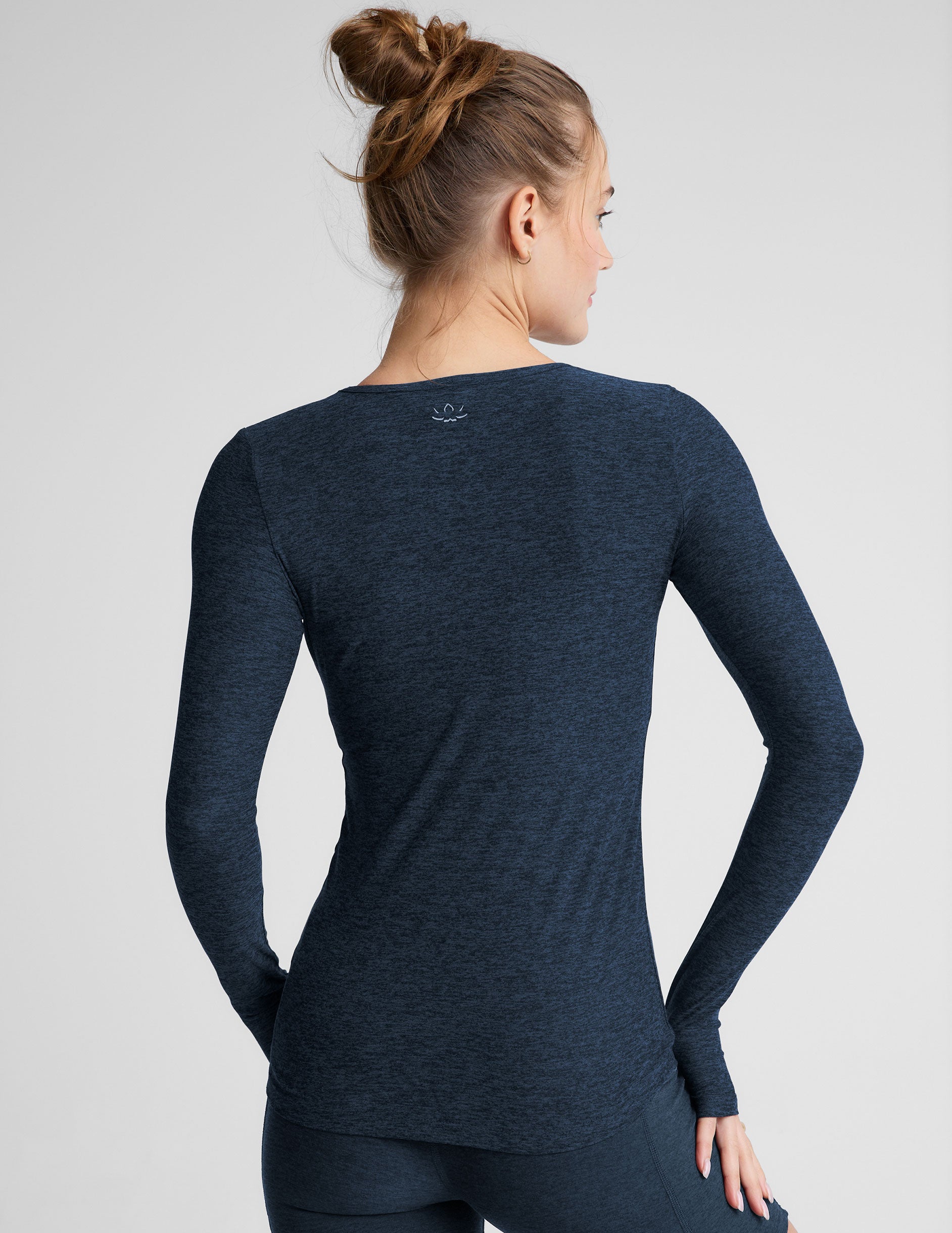 blue long sleeve crew neck top with thumb holes. 