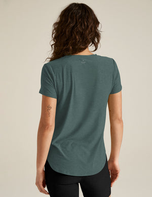 blue short sleeve crew-neck athleisure top. 