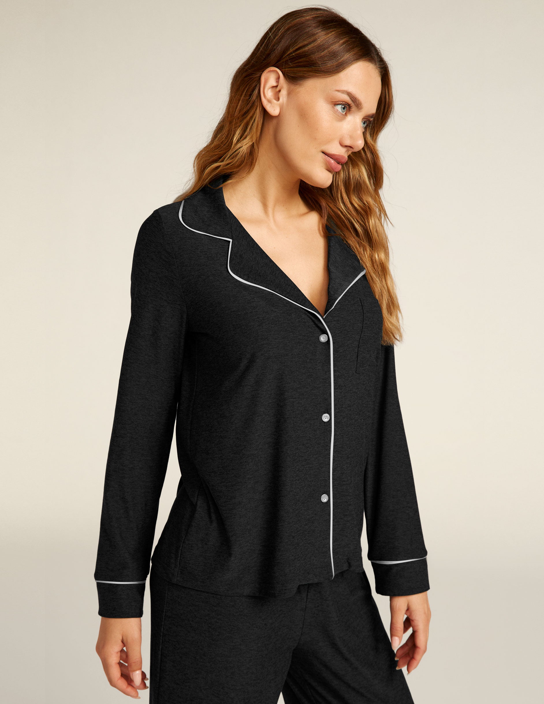 black long sleeve sleep top with white piping. 