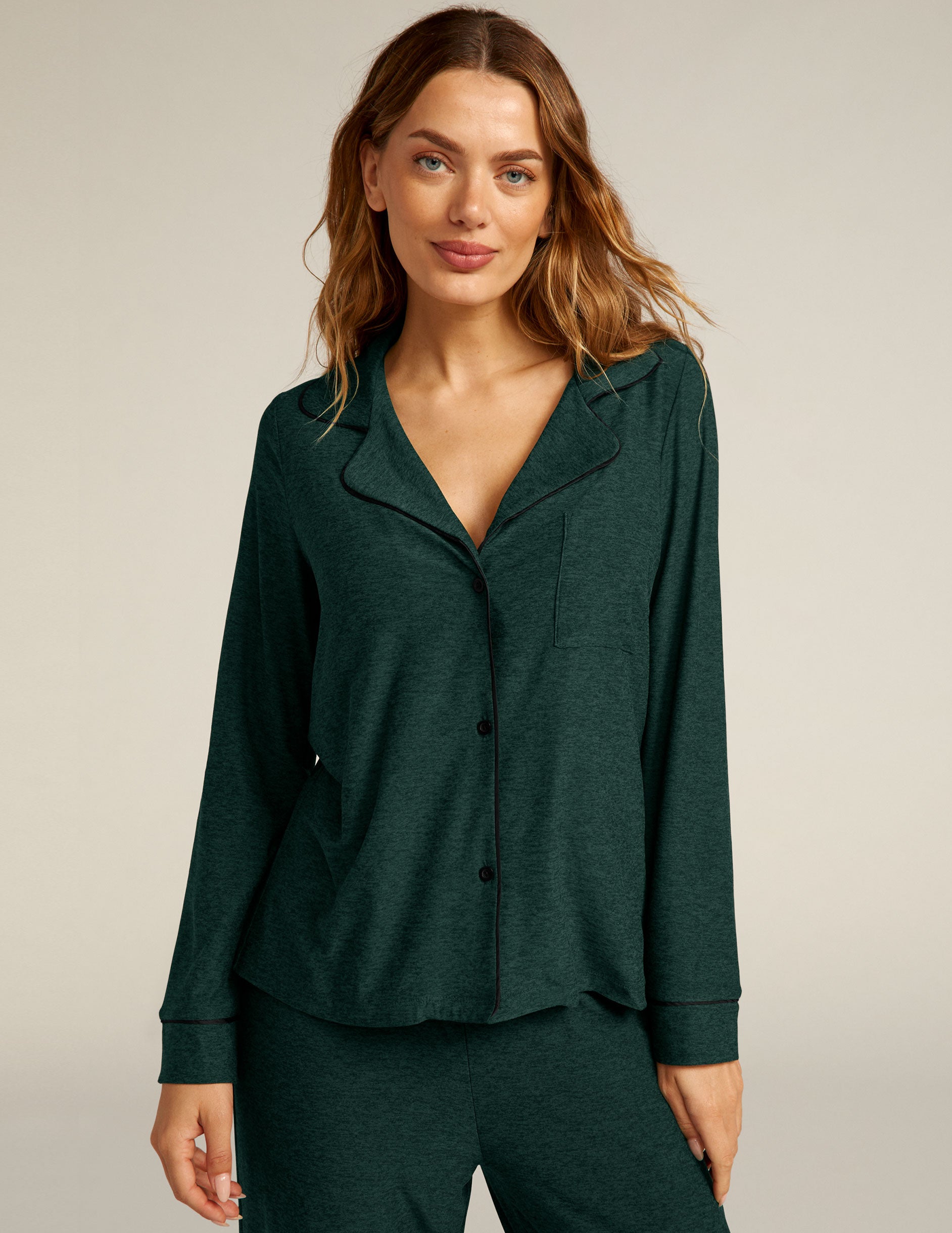 green button up sleep shirt with black piping. 