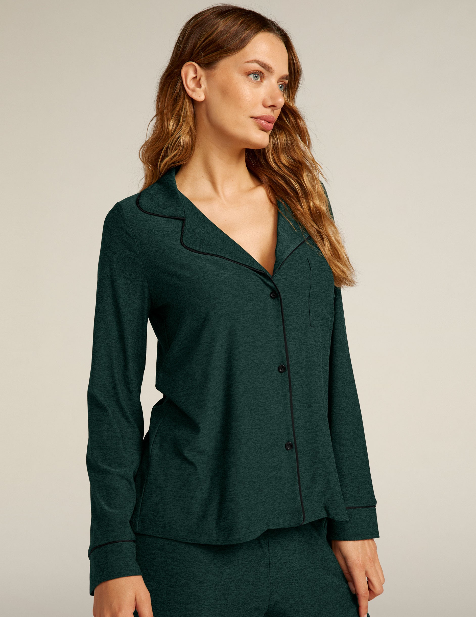 green button up sleep shirt with black piping. 