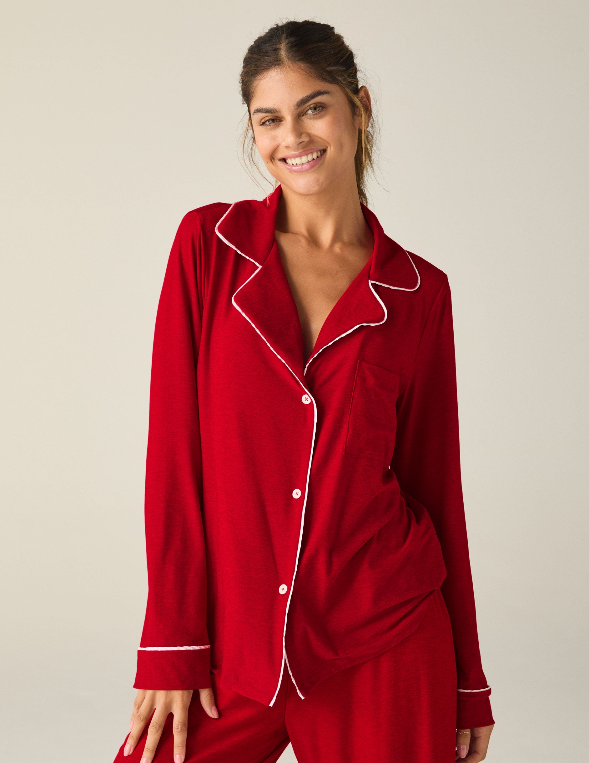 red button-up sleep shirt with white piping. 