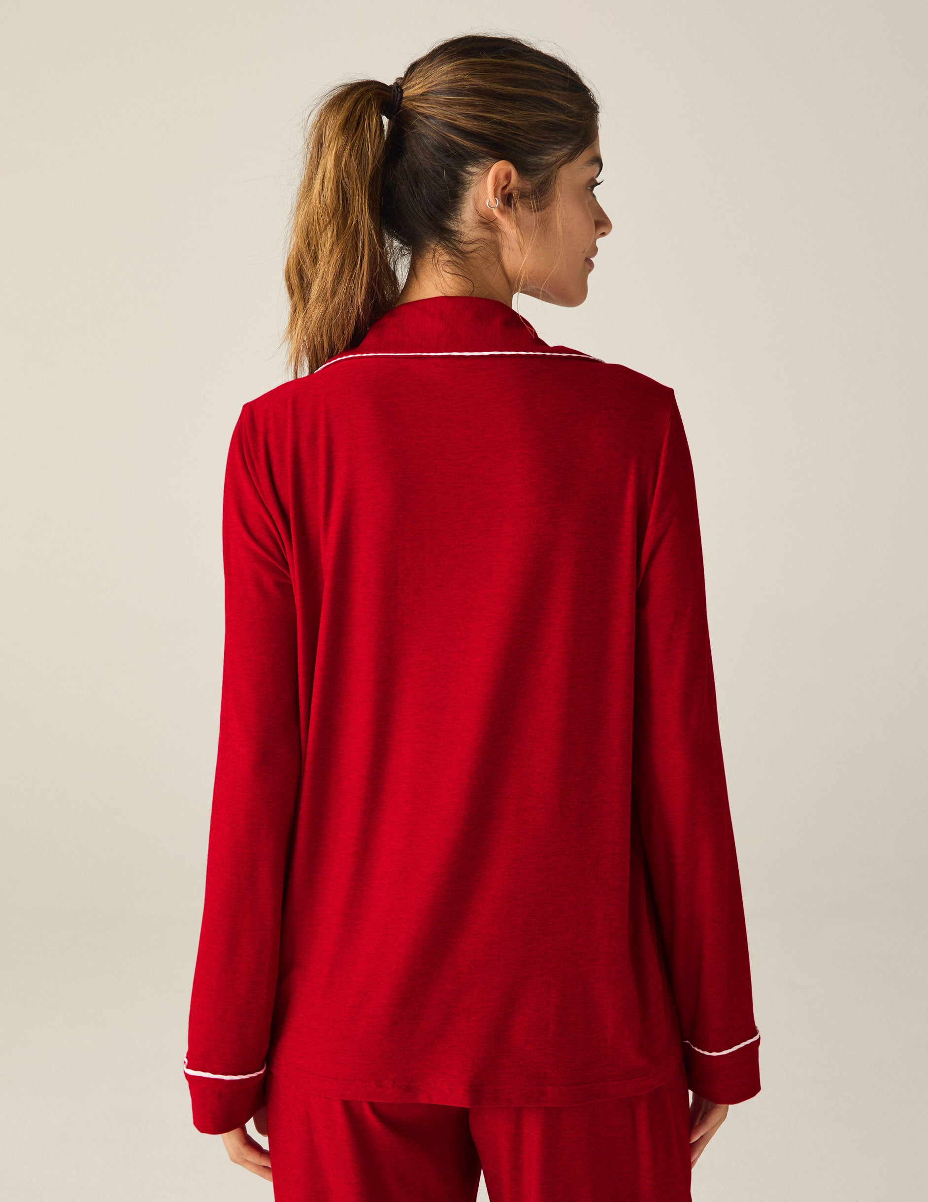 red button-up sleep shirt with white piping. 