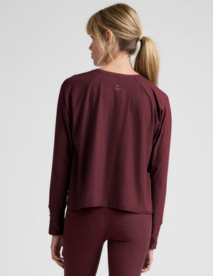 red scoop neck long sleeve relaxed fit top. 