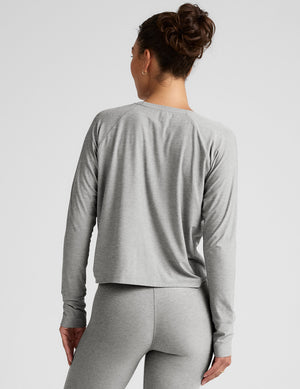 gray long sleeve crew neck top. 