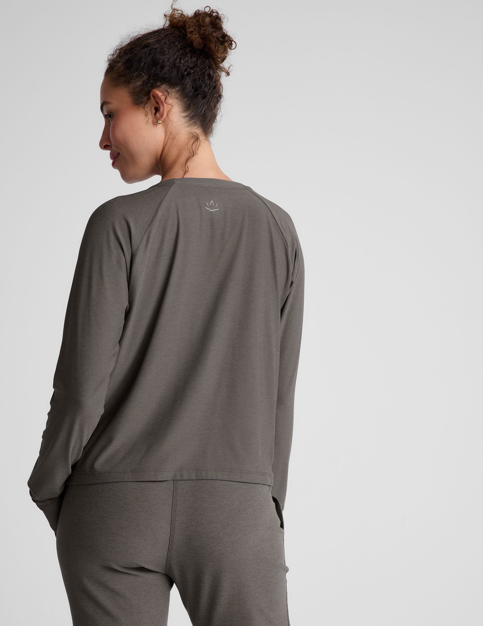 gray long sleeve lightweight top with a crew neckline. 