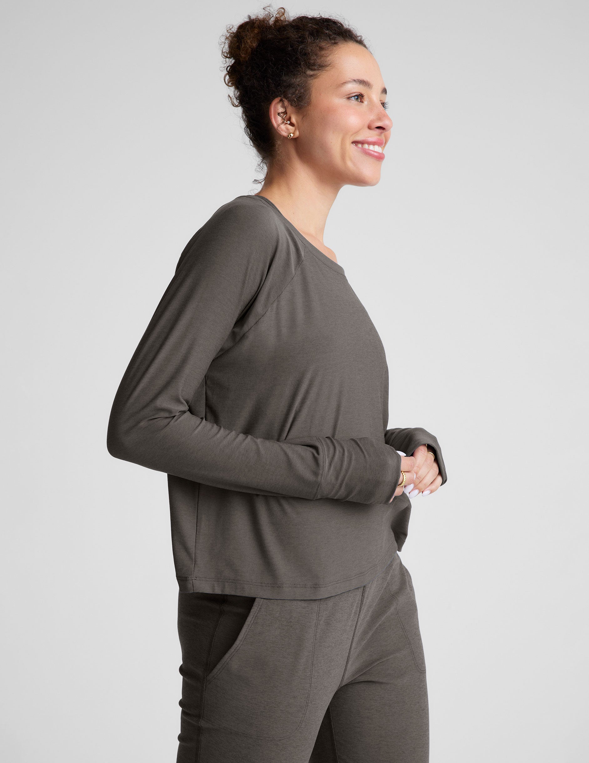 gray long sleeve lightweight top with a crew neckline. 