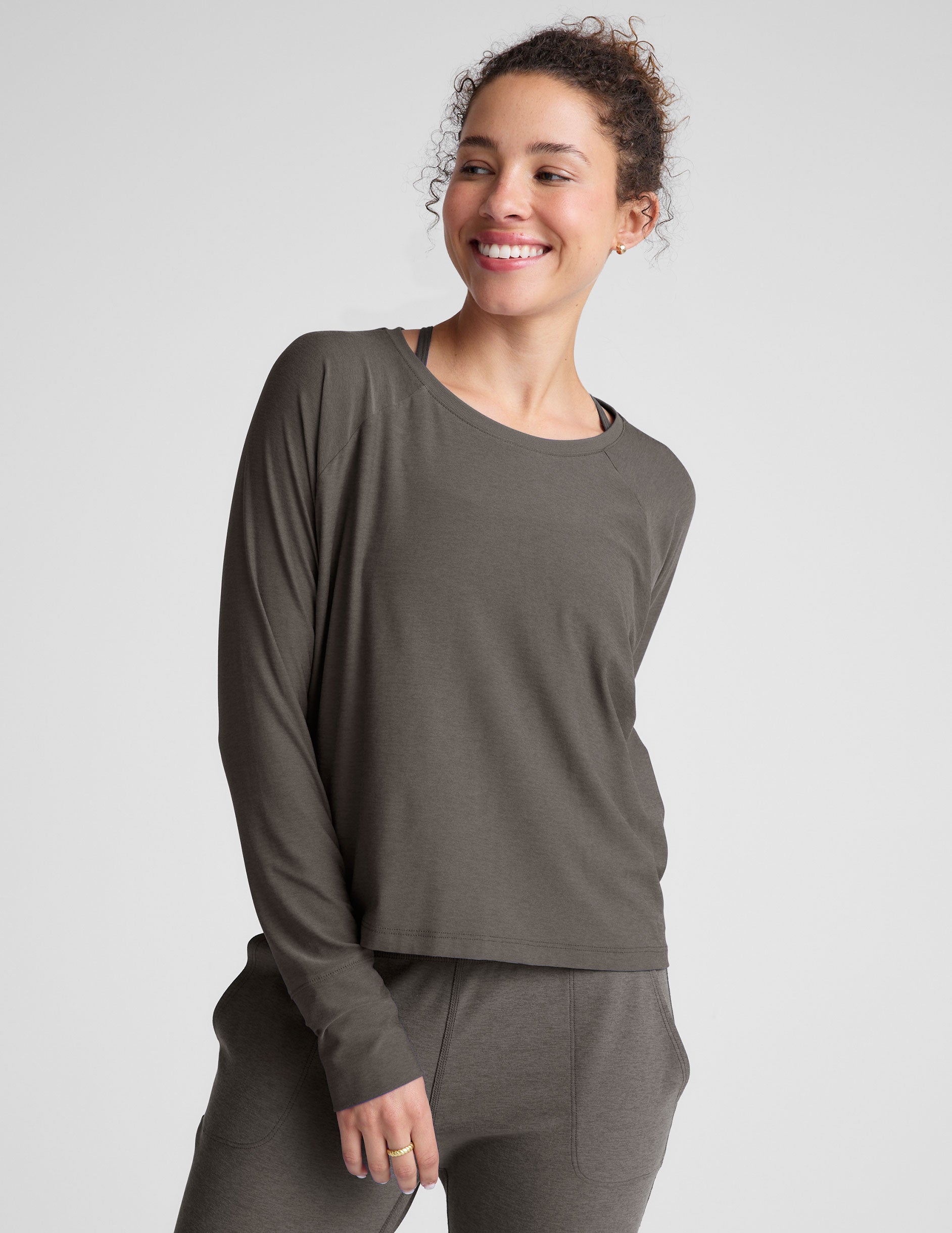 gray long sleeve lightweight top with a crew neckline. 