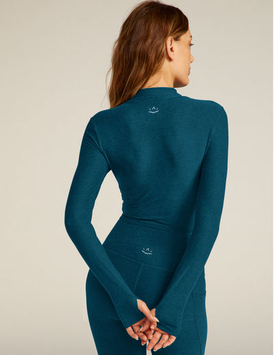 blue mock neck cropped pullover. 