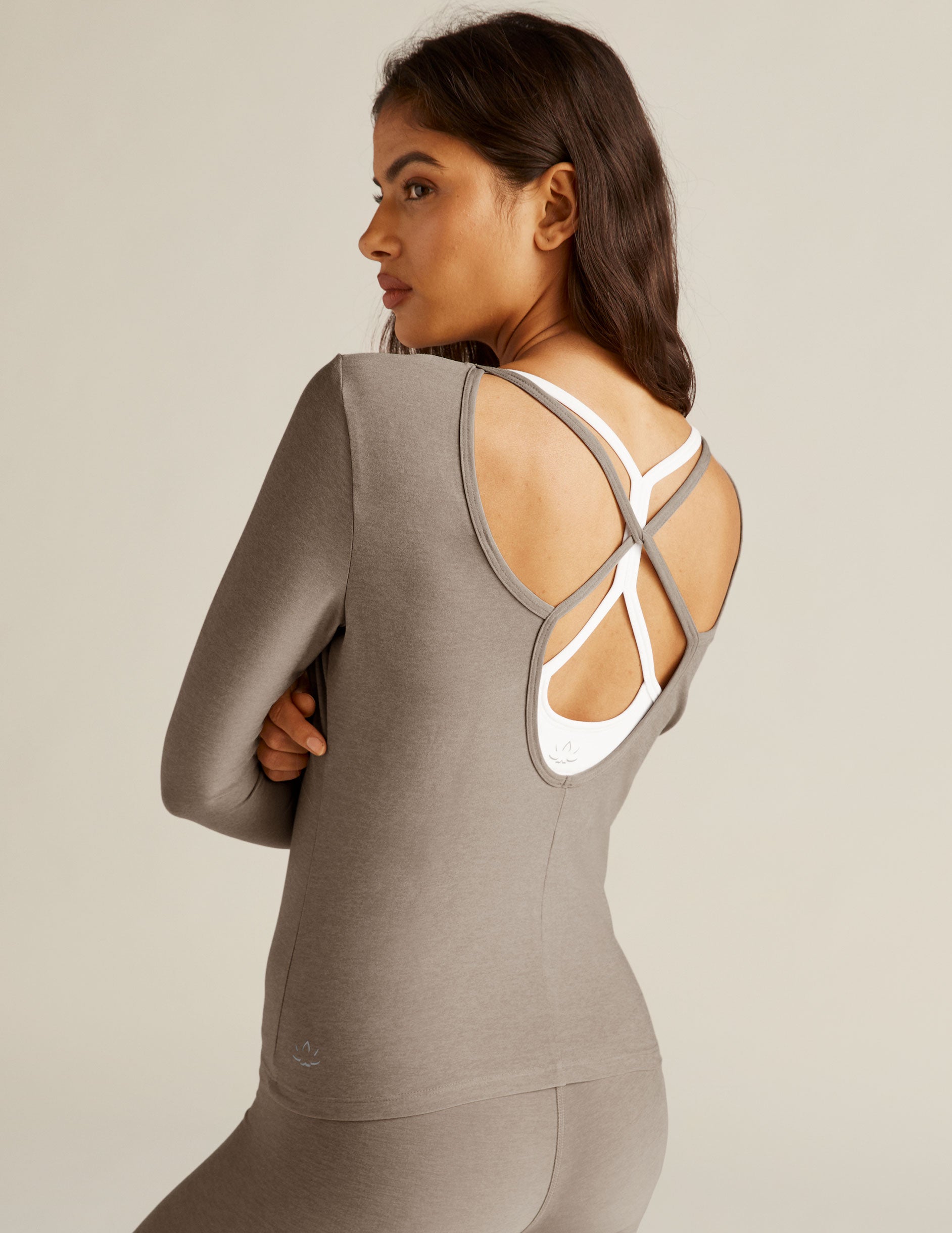 brown long sleeve pullover with open back and twisted strap detail