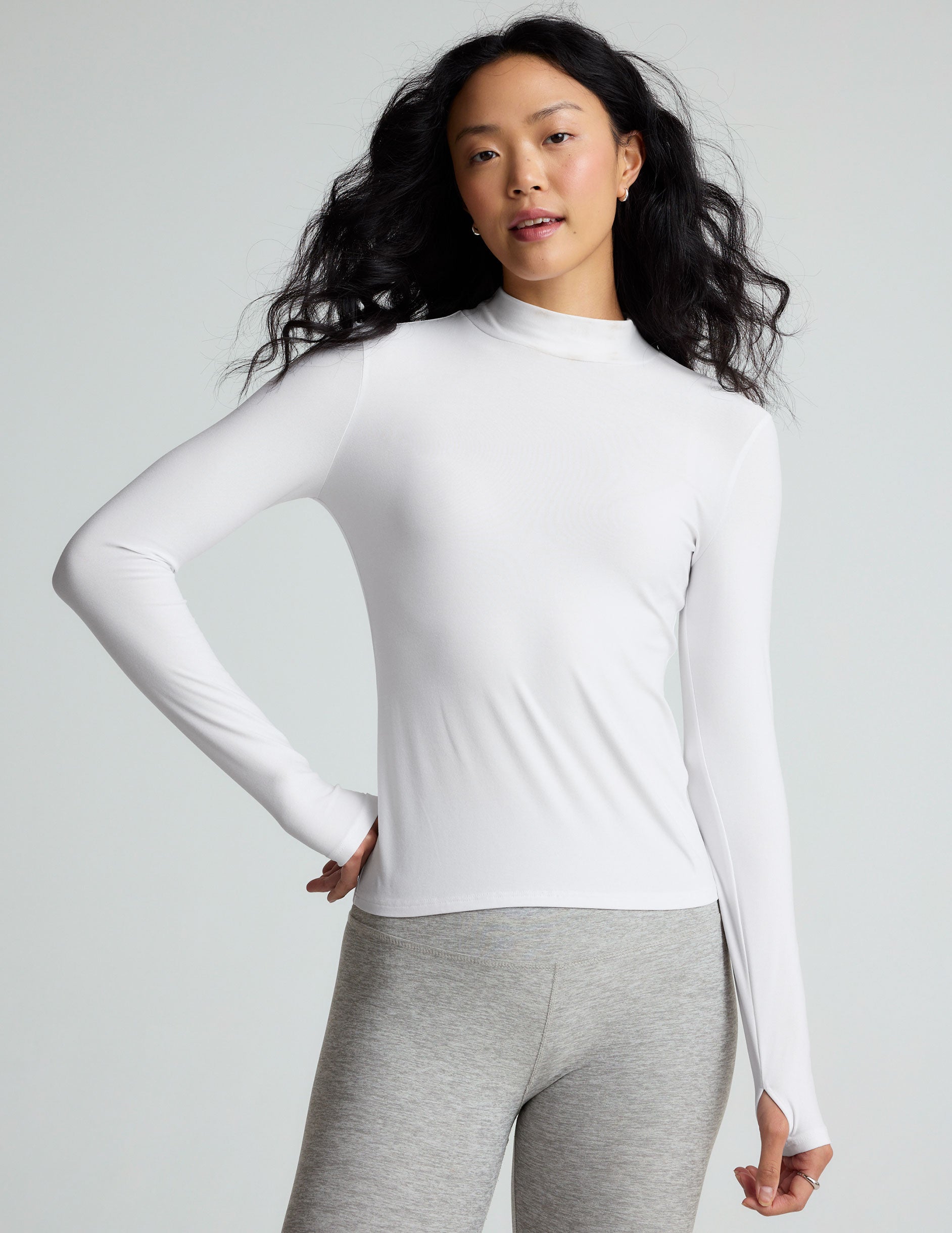 white mock neck long sleeve top.